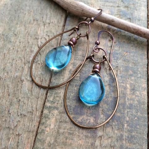 light blue Czech glass teardrop earrings with hammered copper hoop